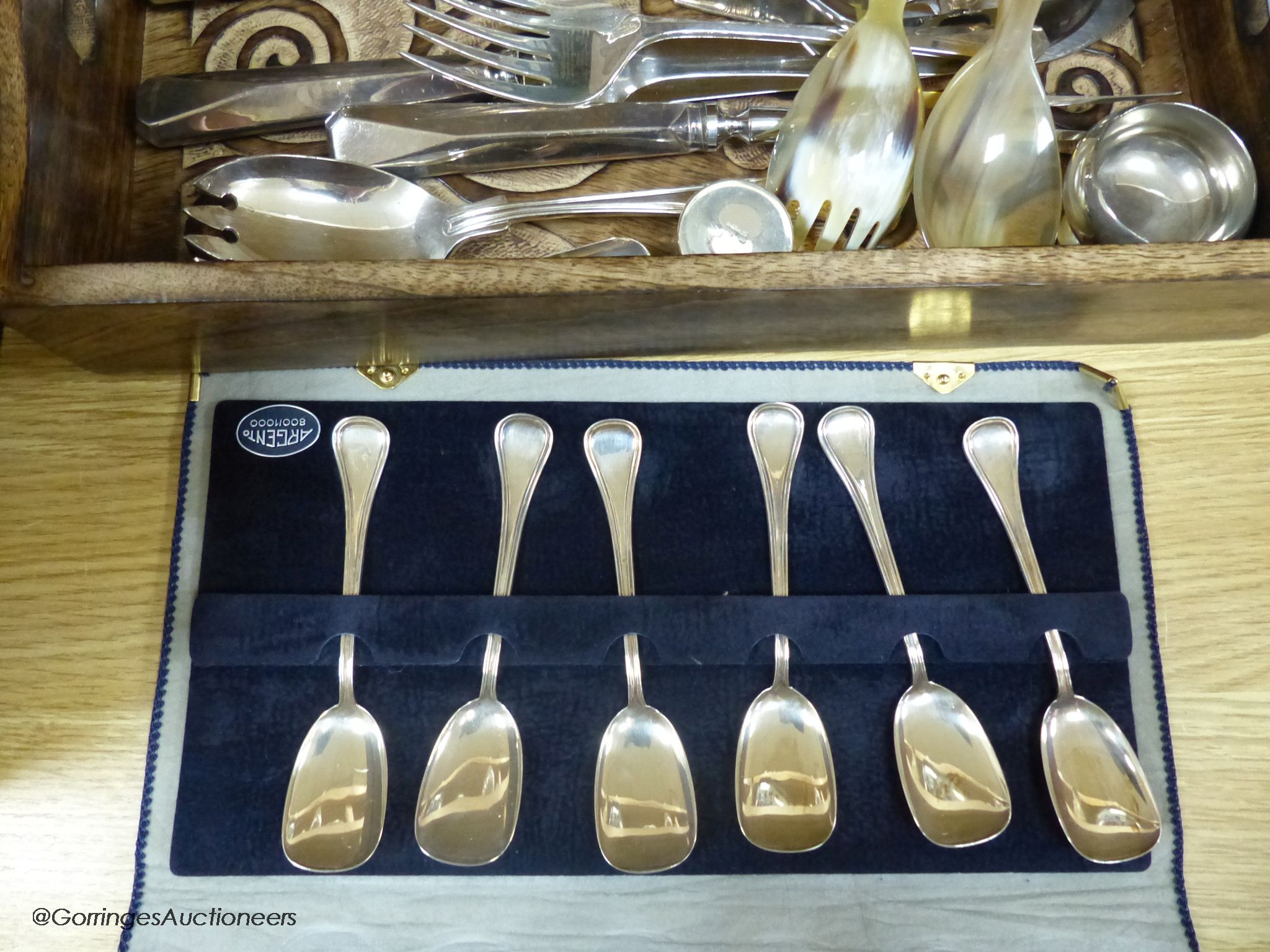 Five Italian 800 standard tea spoons, and six dessert spoons, a silver napkin ring, an 800 standard pill box and a quantity of plated cutlery.